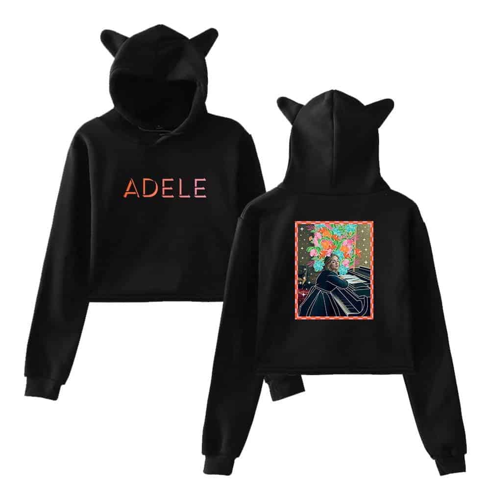 Black hoodie with cat ears and ADELE text in colorful gradient, featuring a vibrant cartoon-style artwork of Adele playing piano on the back.