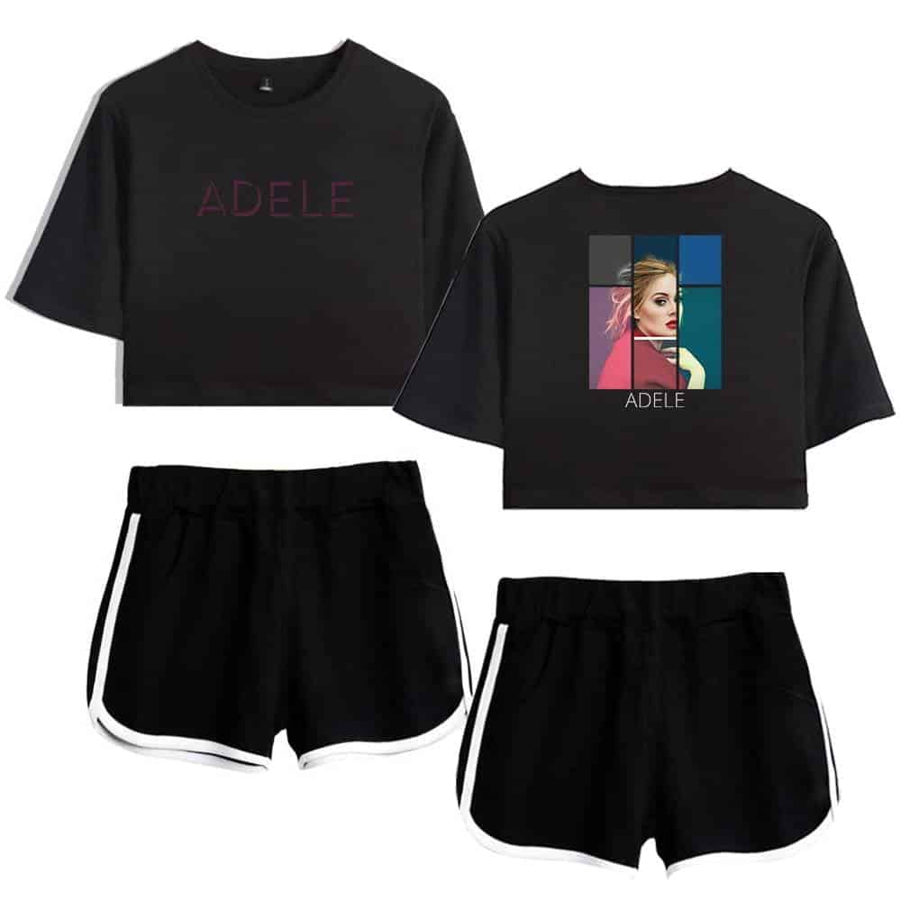 Adele merchandise set featuring a black cropped t-shirt with her name in pink and a colorful artistic portrait on the back, paired with black athletic shorts with white trim.