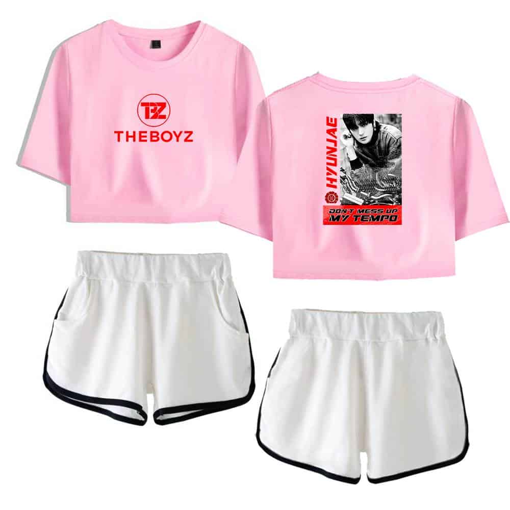 Pink cropped t-shirt with "THEBOYZ" logo and graphic print on the back, paired with white athletic shorts with black trim. Perfect for casual wear or sporty looks.