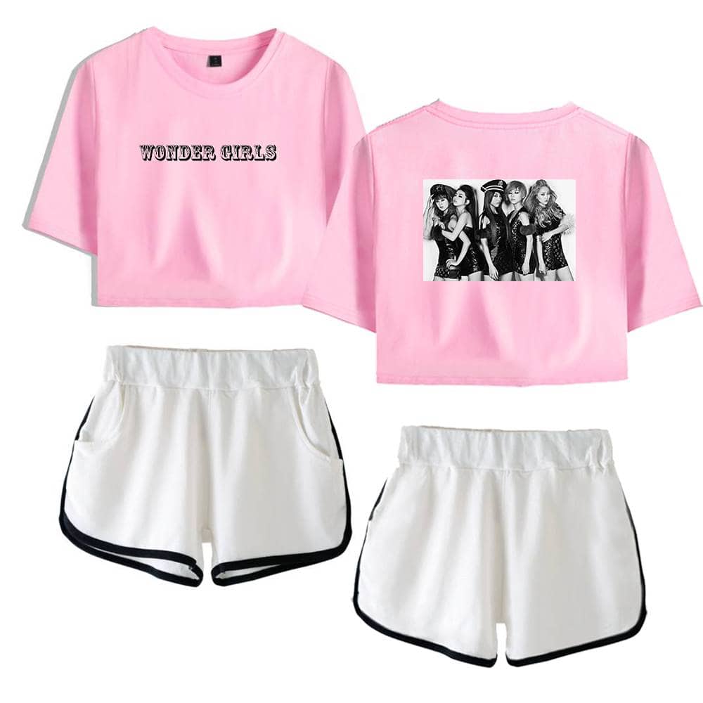 Wonder Girls pink graphic crop top and white athletic shorts with black trim, featuring a group photo and bold text, perfect for trendy casual wear or fan merchandise.