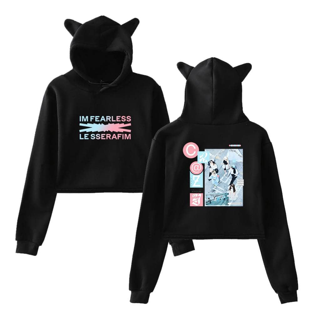 Black hooded sweatshirt for kids featuring cat ear details and colorful graphic design with "I'm Fearless Less Serafim" text on the front. Perfect for casual wear and making a bold statement.