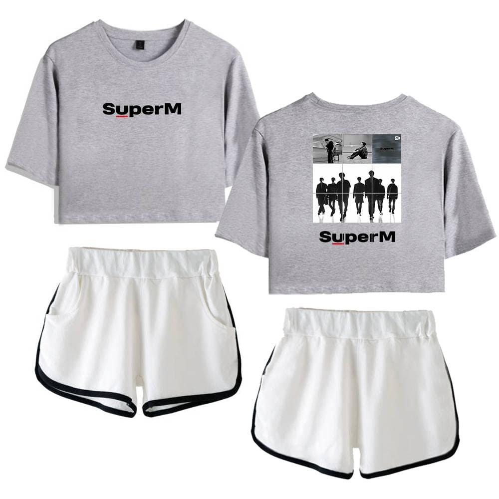 SuperM grey crop top with graphic print and logo, paired with white shorts featuring black trim, casual sporty apparel, perfect for fans of the K-pop group, stylish and comfortable merchandise.