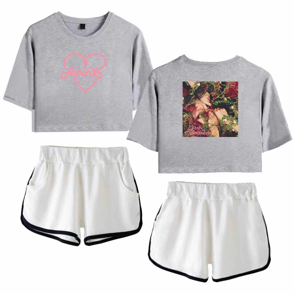 Pink Christmas graphic t-shirt and shorts set, casual apparel for women, includes a grey cropped t-shirt with pink heart design, and comfortable white shorts with black trim. Perfect for lounging or festive occasions.