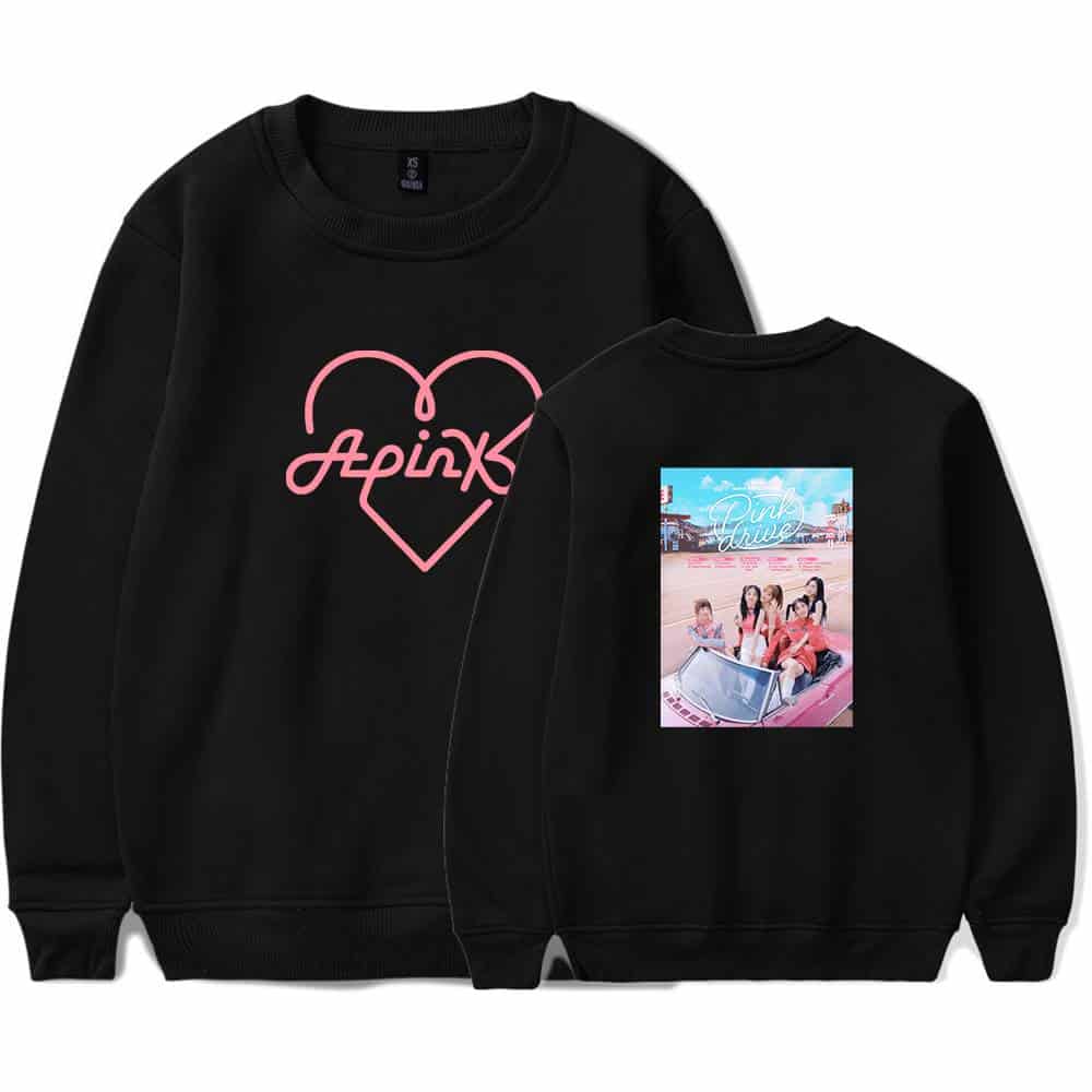 Apink sweatshirt with pink heart and logo design, featuring a photo back print of the girl group at a theme park, perfect for casual wear and fan merchandise.