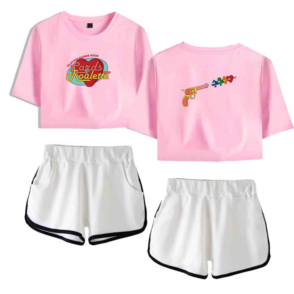 Pink graphic t-shirt with a colorful "Cards Kouette" logo and a playful gun design on the back, paired with white athletic shorts with black trim. Perfect for casual or sporty wear.