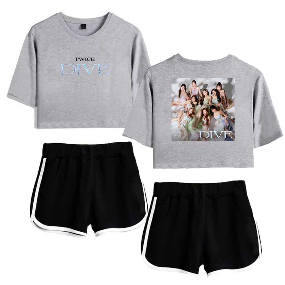 A grey cropped t-shirt featuring the word "DIVE" in light blue text, paired with black athletic shorts that have white trim, perfect for casual wear or sports. The design showcases merchandise inspired by TWICE's album or concept.