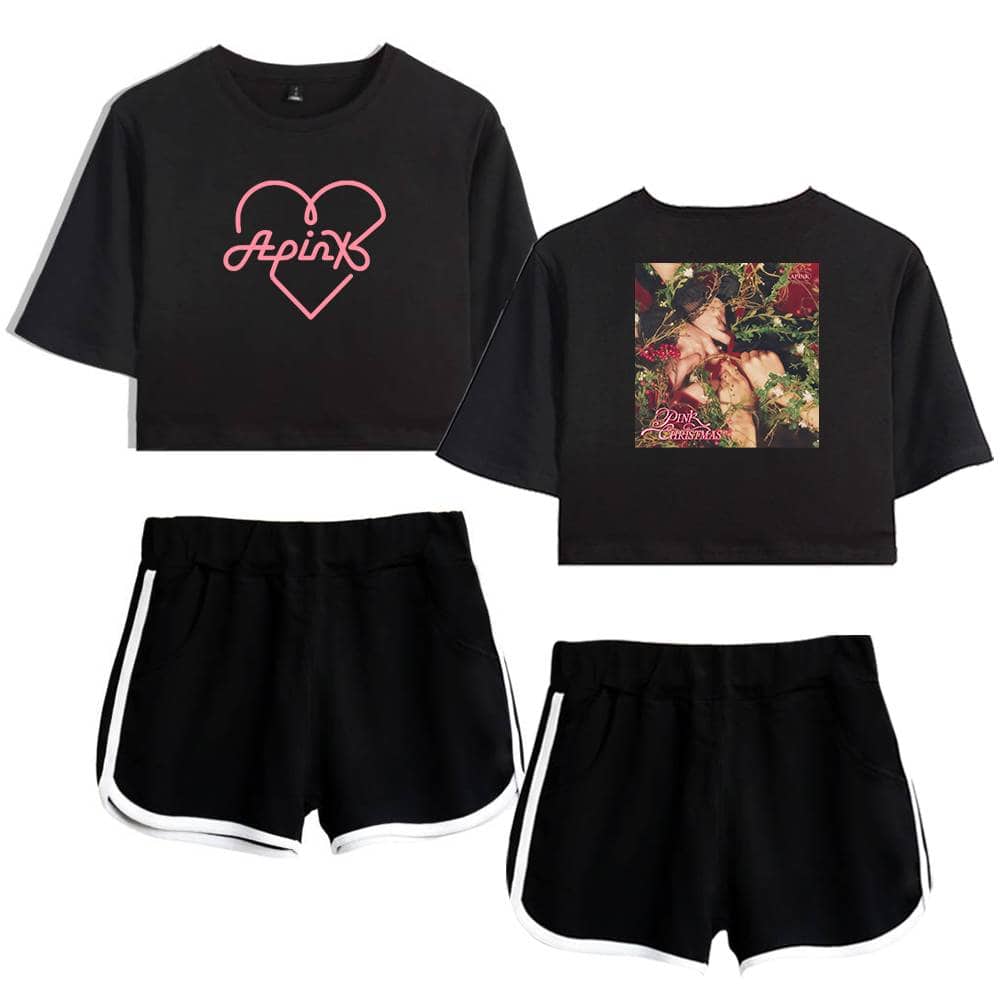 Pink heart outline with "Apink" text in script, on a black cropped t-shirt.