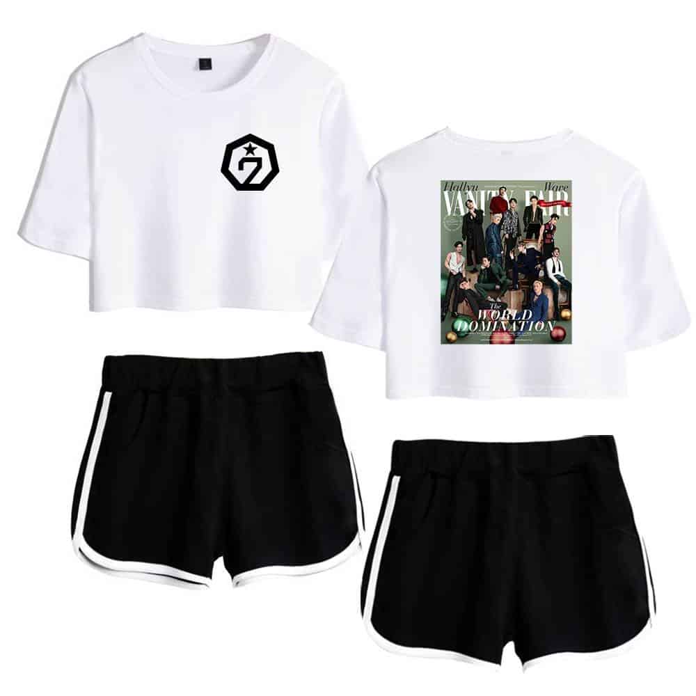 White cropped t-shirt with logo and graphic print, black shorts with white stripes, casual streetwear merchandise set.