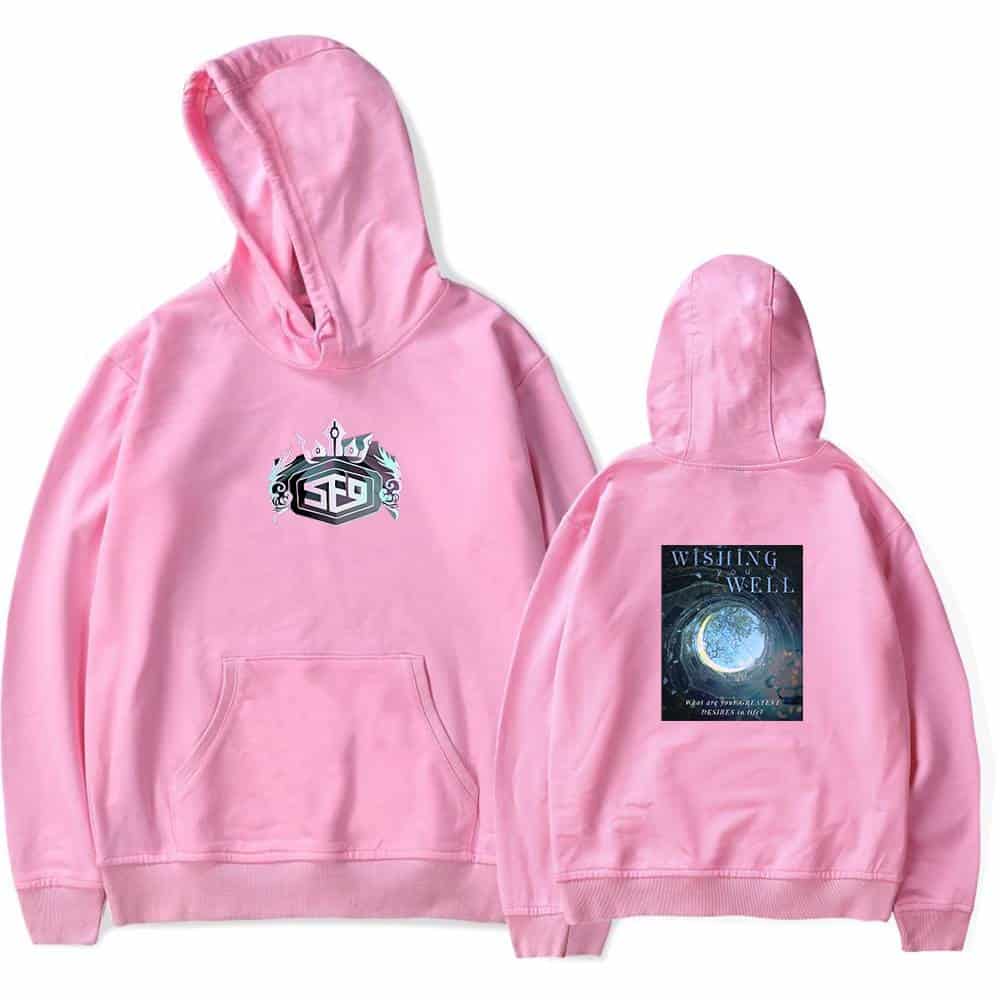 LEDGE LOGO AND WISHING WELL BOOK COVER HOODIE Pink hoodie featuring a unique LEDGE logo on the front and a "Wishing Well" book cover design on the back, perfect for fans of stylish, themed merchandise.