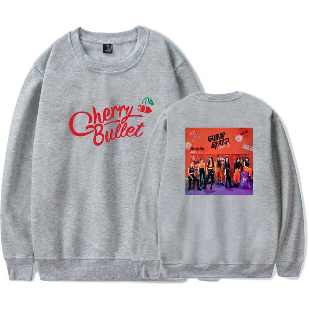 Cherry Bullet sweatshirt with front logo and back group photo design. Casual grey crewneck sweatshirt featuring the K-pop group's logo and a vibrant back print of the members. Perfect for fans to show support.