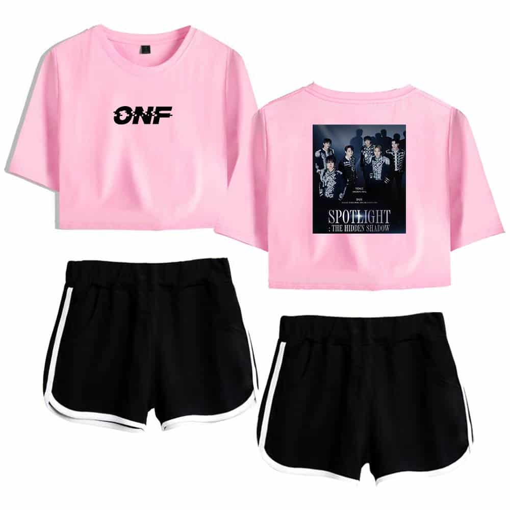 ONF pink and black apparel set, featuring a cropped pink T-shirt with ONF logo on the front and a concert-themed graphic on the back, paired with black athletic shorts with white stripes.
