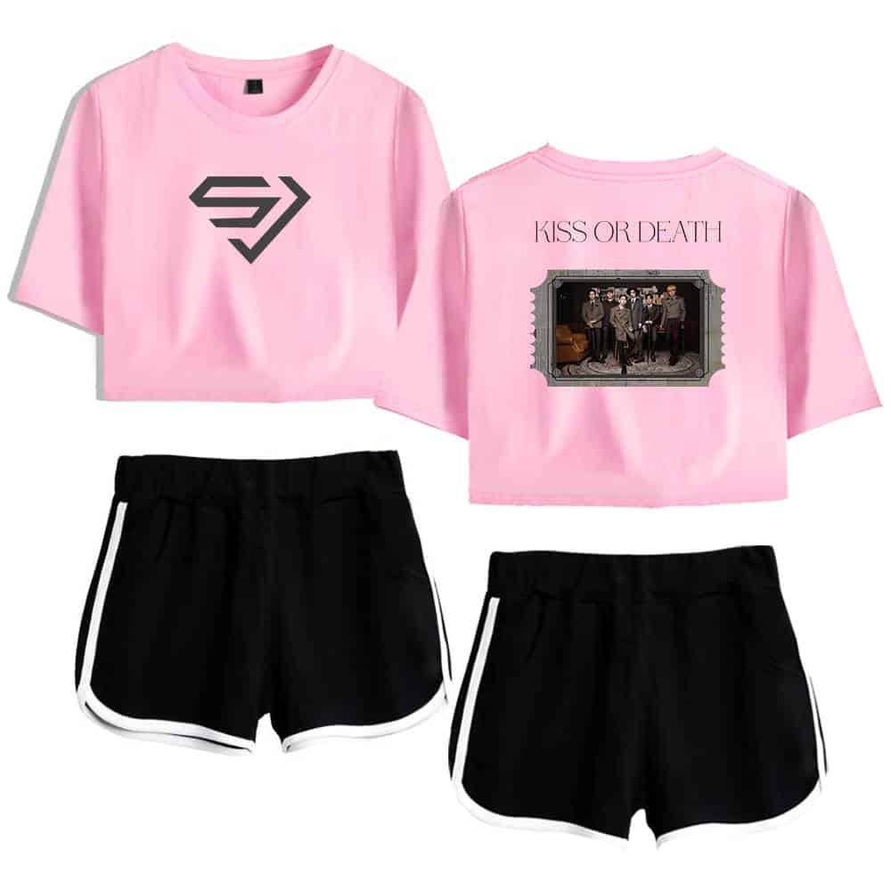 Pink cropped t-shirt with a bold black logo on the front and a band photo with "KISS OR DEATH" text on the back, paired with black athletic shorts with white trim.