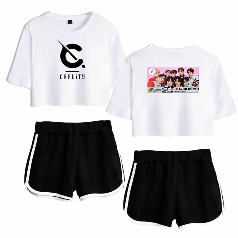 Cropped graphic t-shirt with black and white color scheme featuring a logo and a group photo, paired with black athletic shorts with white side stripes, casual streetwear style, suitable for fans of K-pop or trendy apparel.