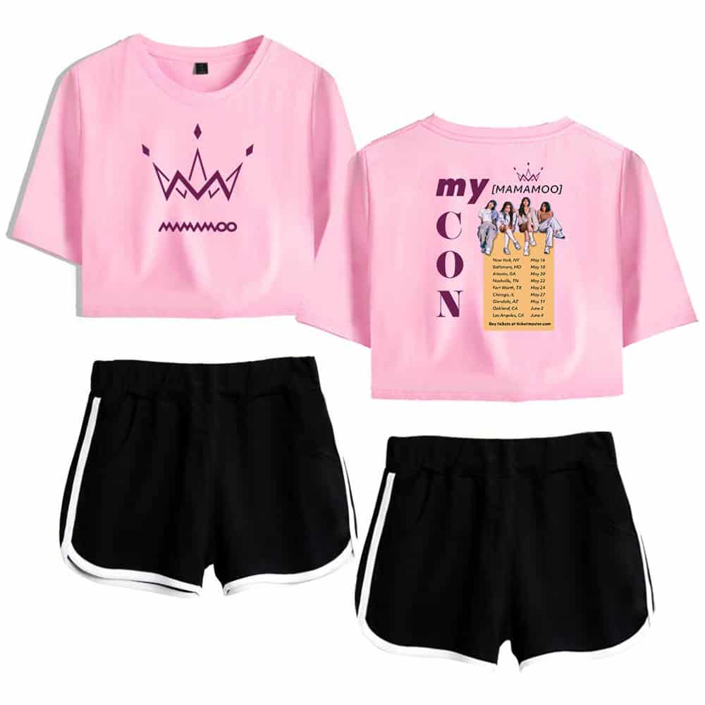 Bright pink cropped T-shirt featuring a minimalist crown graphic on the front and a concert tour design with a group photo of BTS on the back, paired with black athletic shorts with white trim.