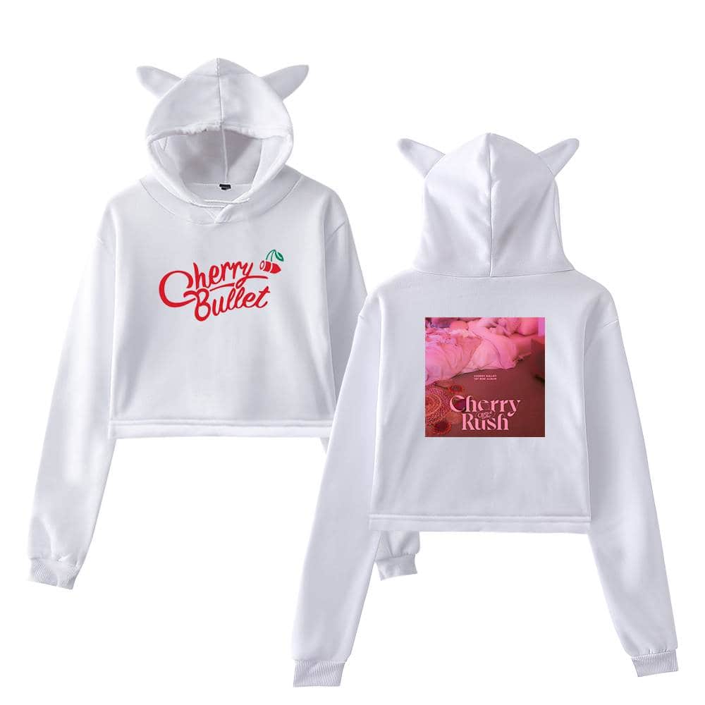 Cherry Bullet hoodie with cute cat ears on the hood, featuring bold red and green cherry logo on the front and a pink-toned graphic print on the back. Stylish and comfy merchandise for fans.