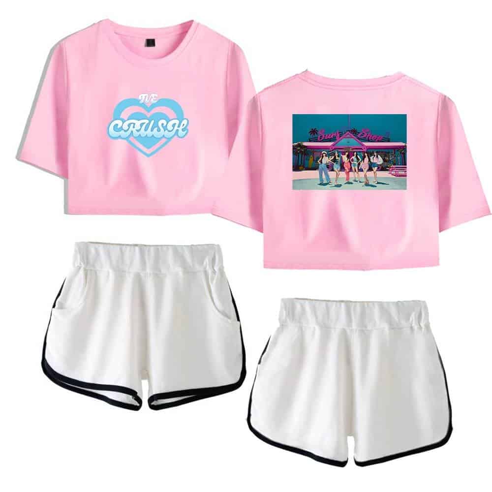 Pink cropped t-shirt with "Crush" heart graphic and back print of a retro-style dance club scene, paired with white athletic shorts with black trim. Perfect summer casual wear.