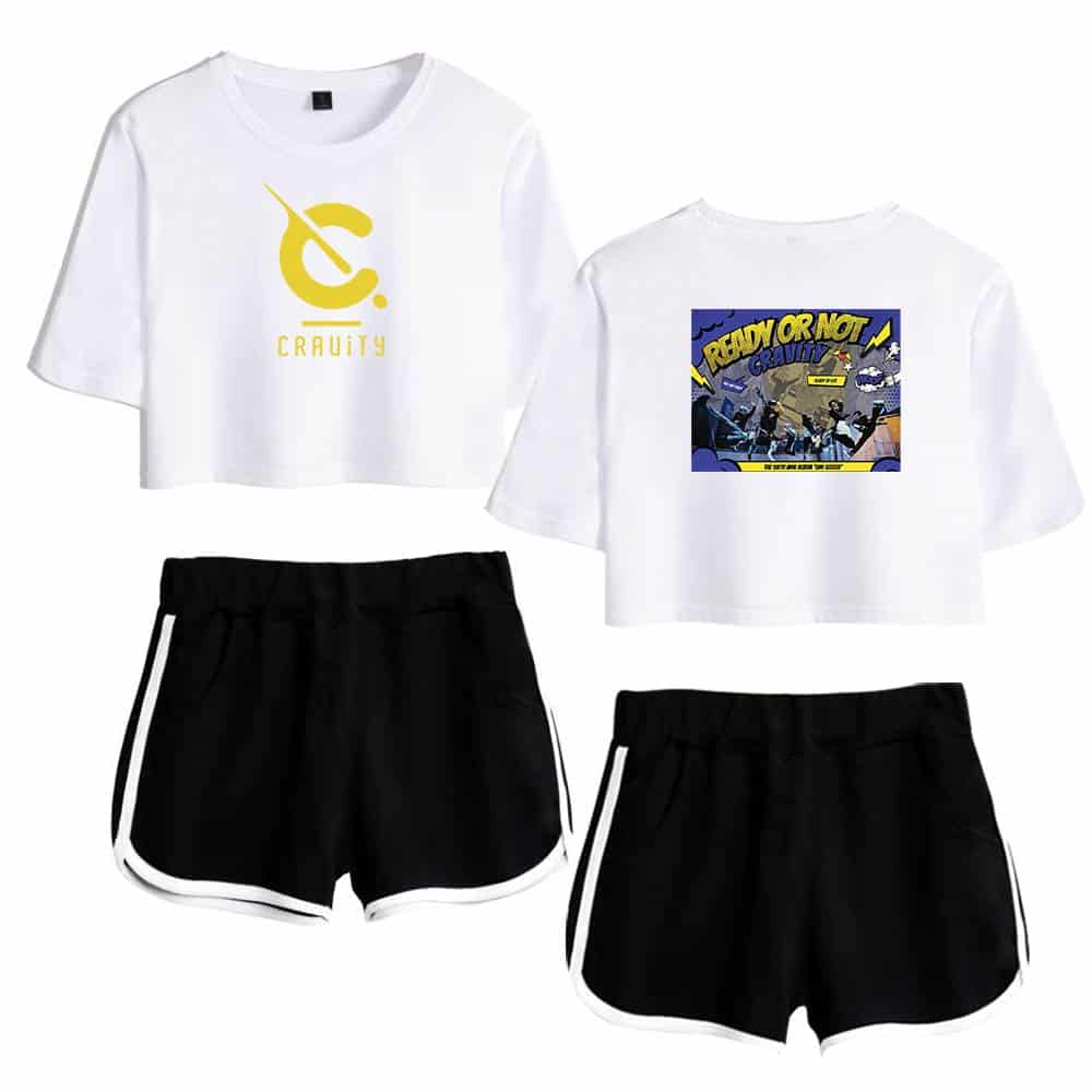 Cravity merch white cropped T-shirt with yellow logo and graphic black athletic shorts with white trim for casual and sporty look.