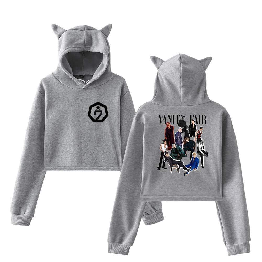 2. Soft gray hoodie with cat ears, featuring G2 logo on the front and a group of diverse models from Vanity Fair on the back, perfect for casual wear and fans of fashion and pop culture.