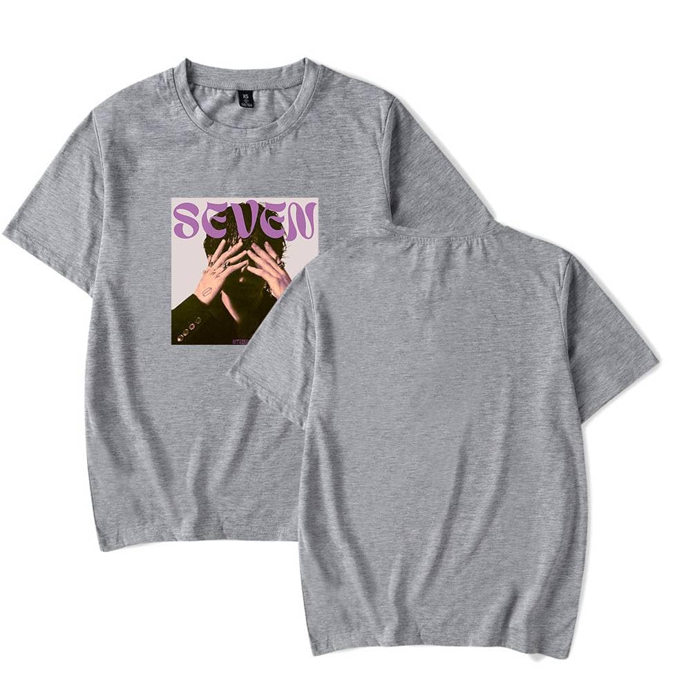 SeVen album cover t-shirt featuring a person covering their face with hands, printed on a classic heather gray cotton tee. Perfect music merchandise for fans of SeVen.
