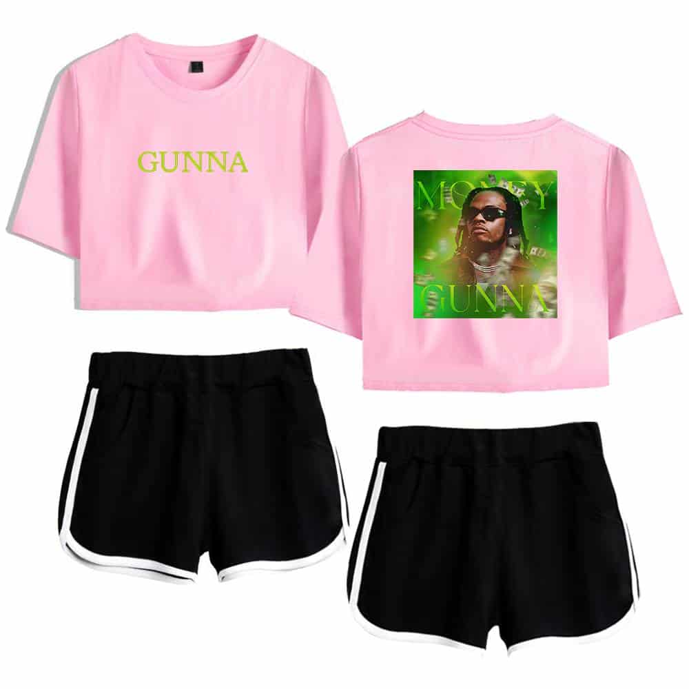 GUNNA pink crop top with bold green text, featuring a graphic of the rapper on the back, paired with black athletic shorts with white trim for a stylish streetwear look.