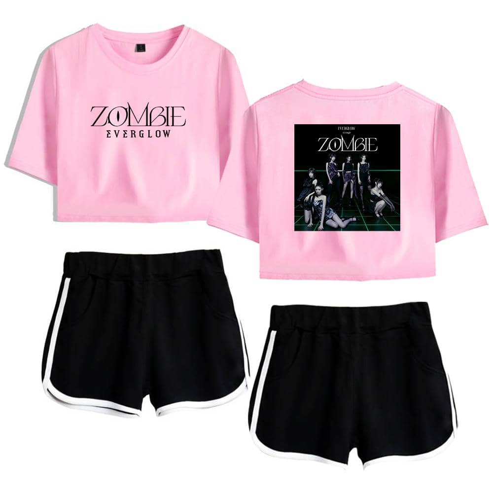 ZOMBIE EVERGLOW pink graphic crop top and black shorts set with white trim, stylish and comfortable for casual wear or concerts, featuring a band-inspired design with a front logo and back album cover image.