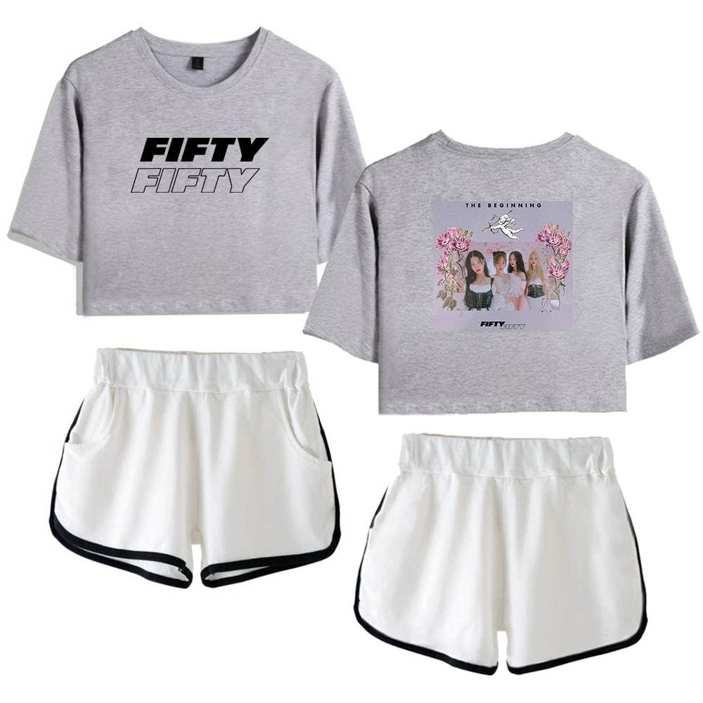 Fifty graphic crop top and printed T-shirt paired with white athletic shorts with black trim, casual streetwear style.