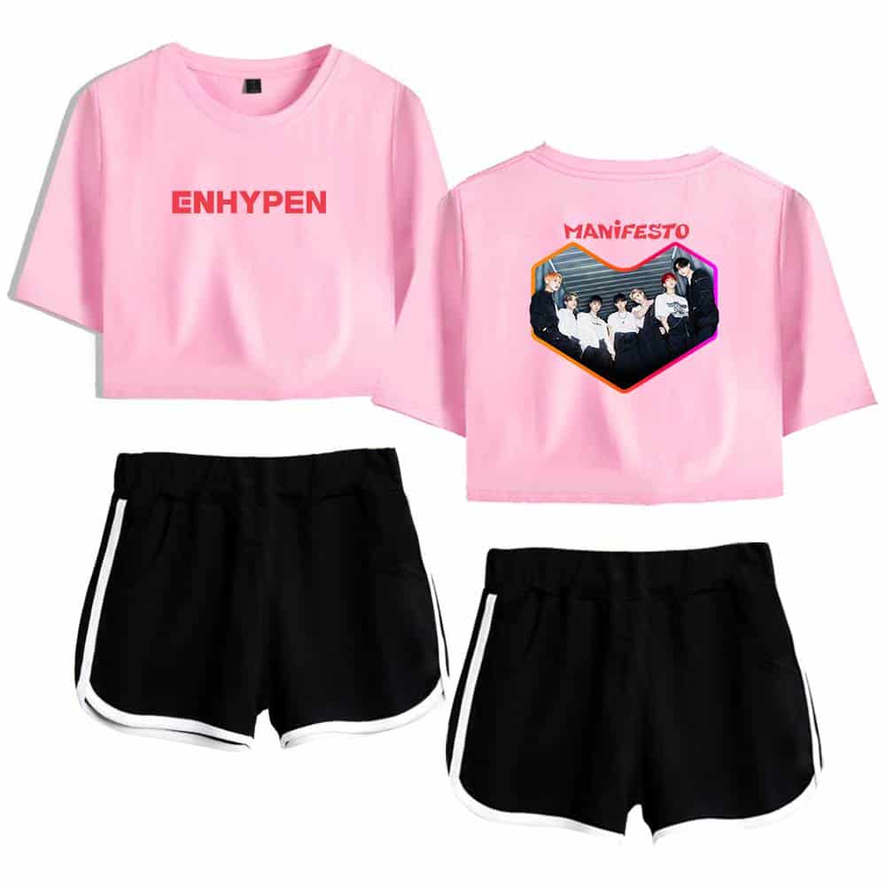 Pink crop top with "ENHYPEN" text on the front and group photo with "MANIFESTO" text on the back, paired with black athletic shorts with white trim, perfect for K-pop fans and casual wear.