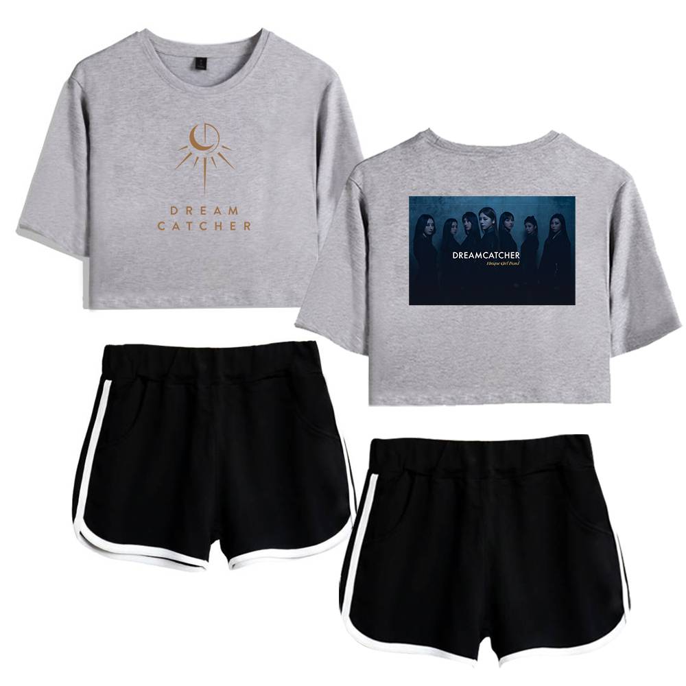 DREAM CATCHER sweatshirt with moon and sun design, paired with black athletic shorts featuring white trim, perfect for casual wear or workout sessions, showcasing trendy and comfortable merchandise.