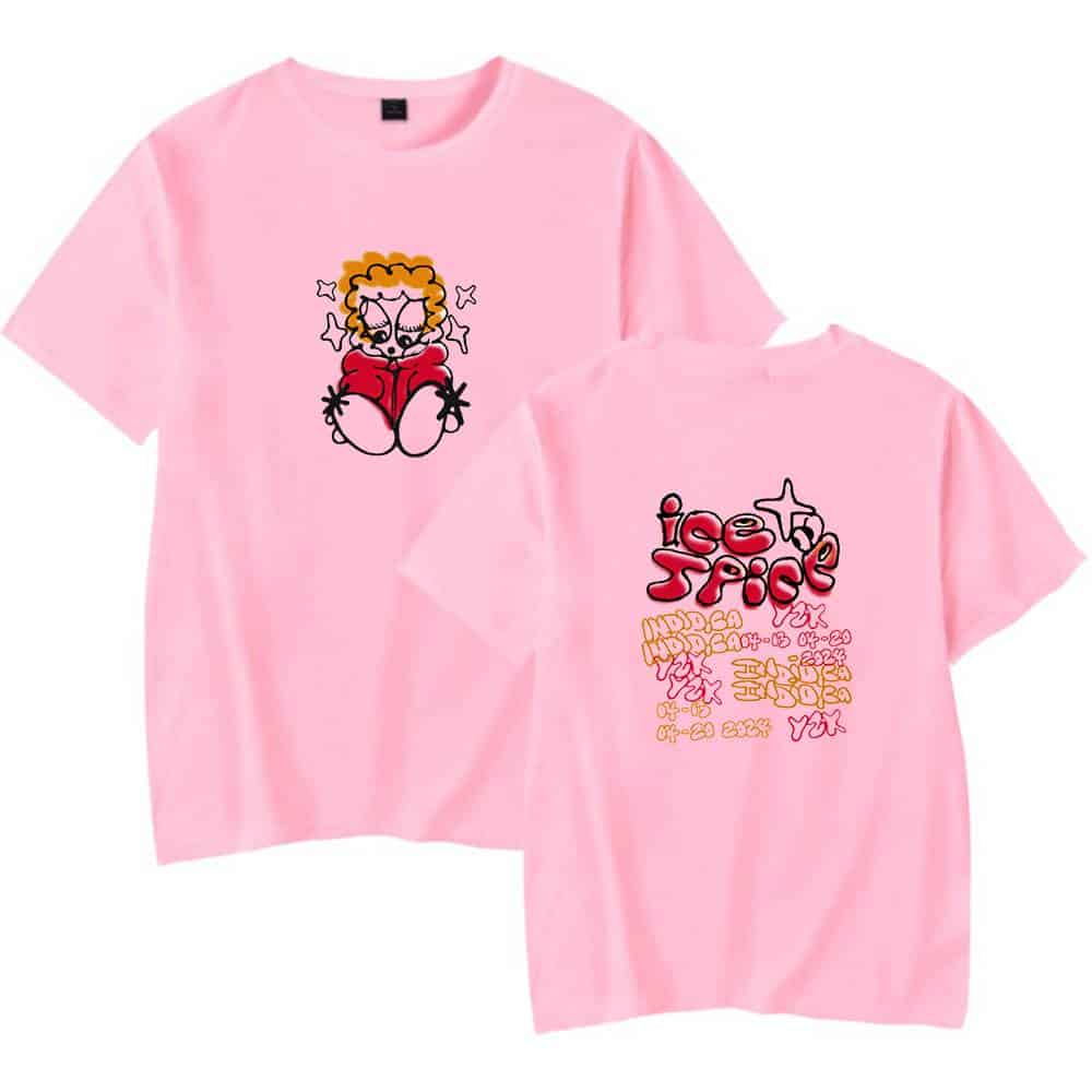Cute pink T-shirt featuring a cartoon girl reading, with bold "ice + spice" text and vibrant graphic details, perfect for trendy casual wear.