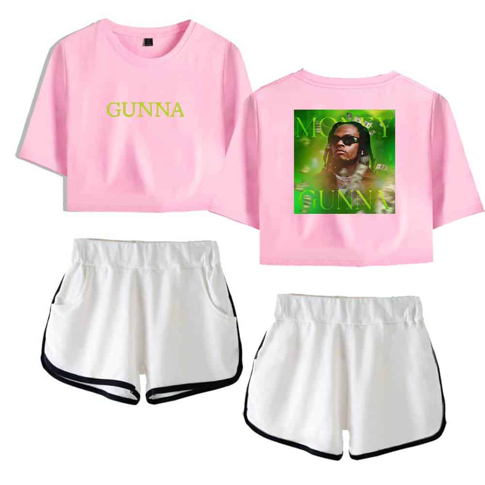 GUNNA pink cropped t-shirt with "GUNNA" text, paired with white athletic shorts with black trim, featuring a stylish streetwear design.