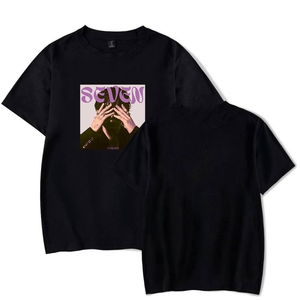 Streetwear black t-shirt featuring a graphic print of a person covering their face, with the word "SEVEN" in purple above. Perfect for casual fashion and music fans.