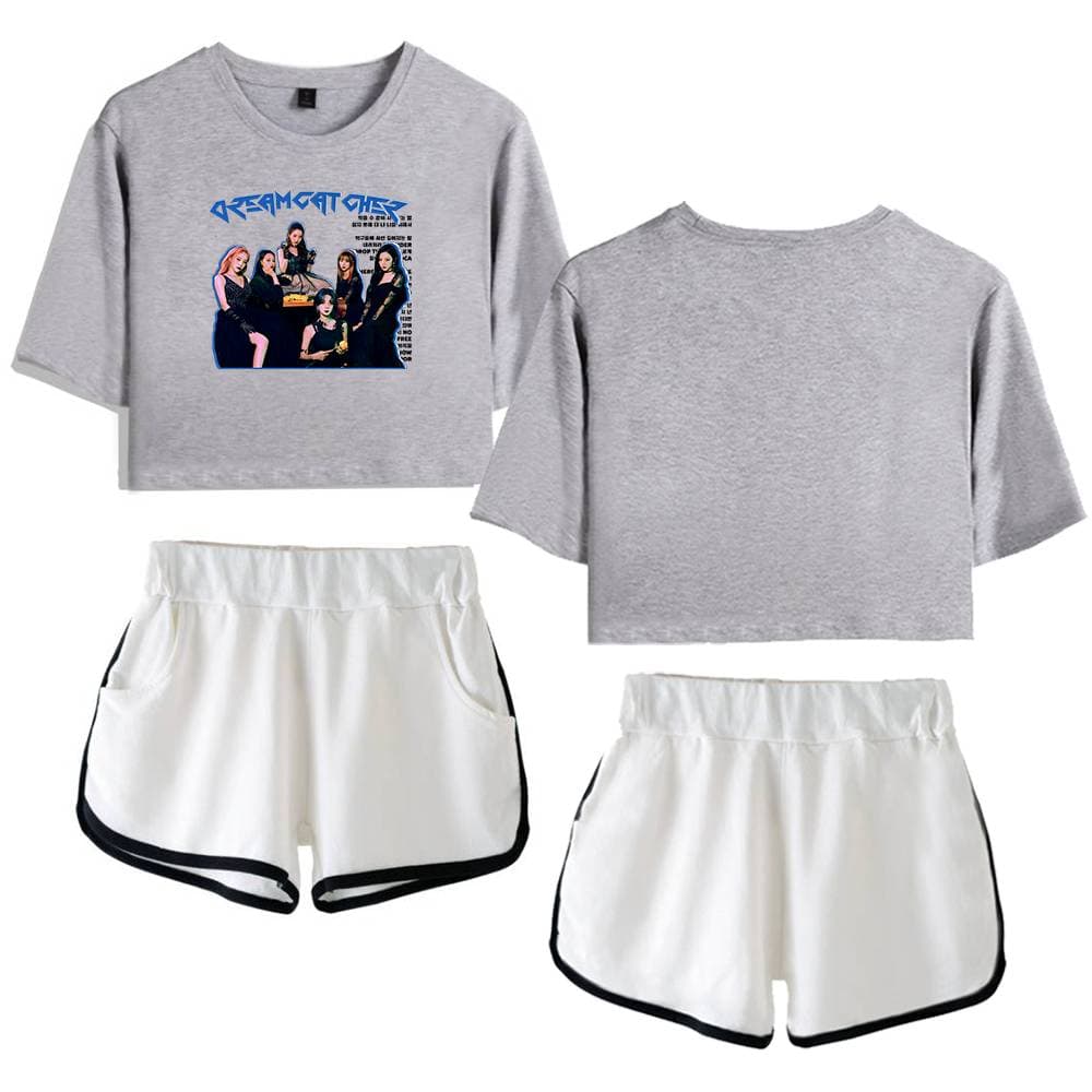 Grey crop sweatshirt featuring a graphic design of a music group with bold blue text. The set includes matching white athletic shorts with black trim, perfect for casual or active wear.
