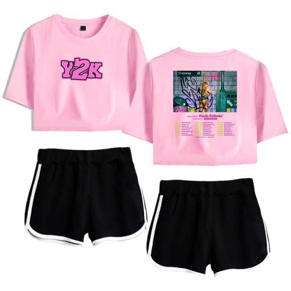 Y2K pink graphic crop top with graffiti and cityscape print, paired with black and white athletic shorts, sportswear, casual streetwear, youth fashion.