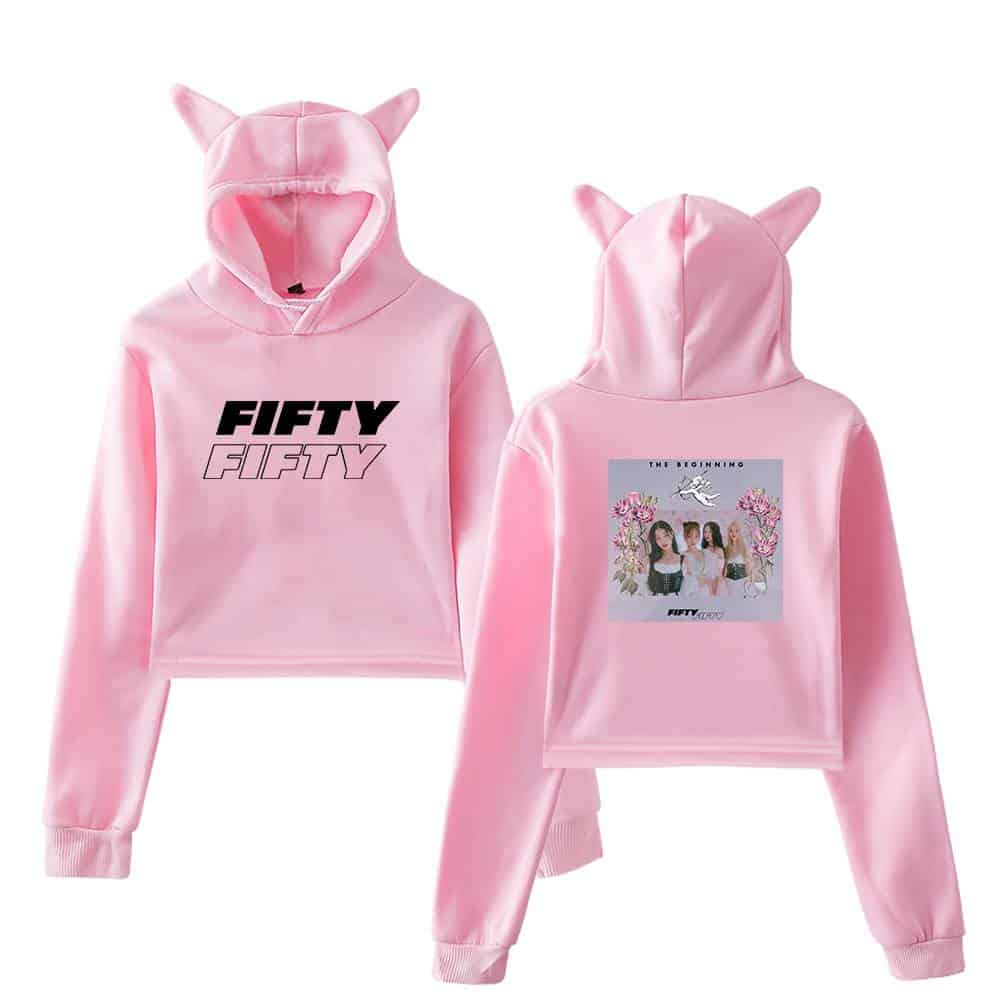 Fifty Fifty pink hoodie with cat ears, front print of "FIFTY FIFTY" text, and back graphic featuring three girls, flowers, and "THE BEGINNING" text, perfect for fans and casual wear.