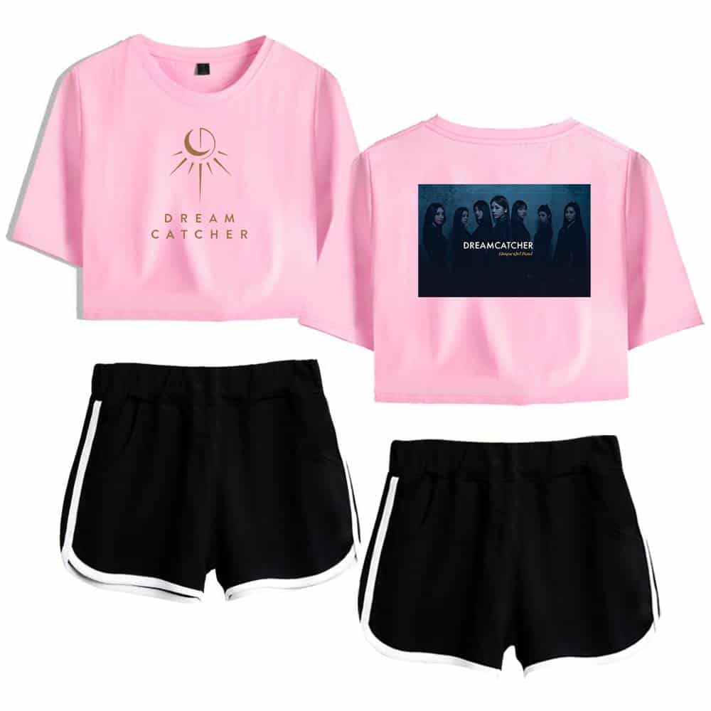 Pink cropped T-shirt with "Dream Catcher" logo and moon graphic, paired with black sporty shorts with white trim. Perfect casual outfit for fans of the Dreamcatcher group or related merchandise.