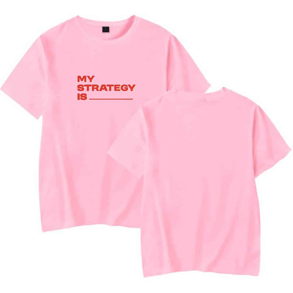 MY STRATEGY IS _____ pink t-shirt with bold red text for casual or statement wear.