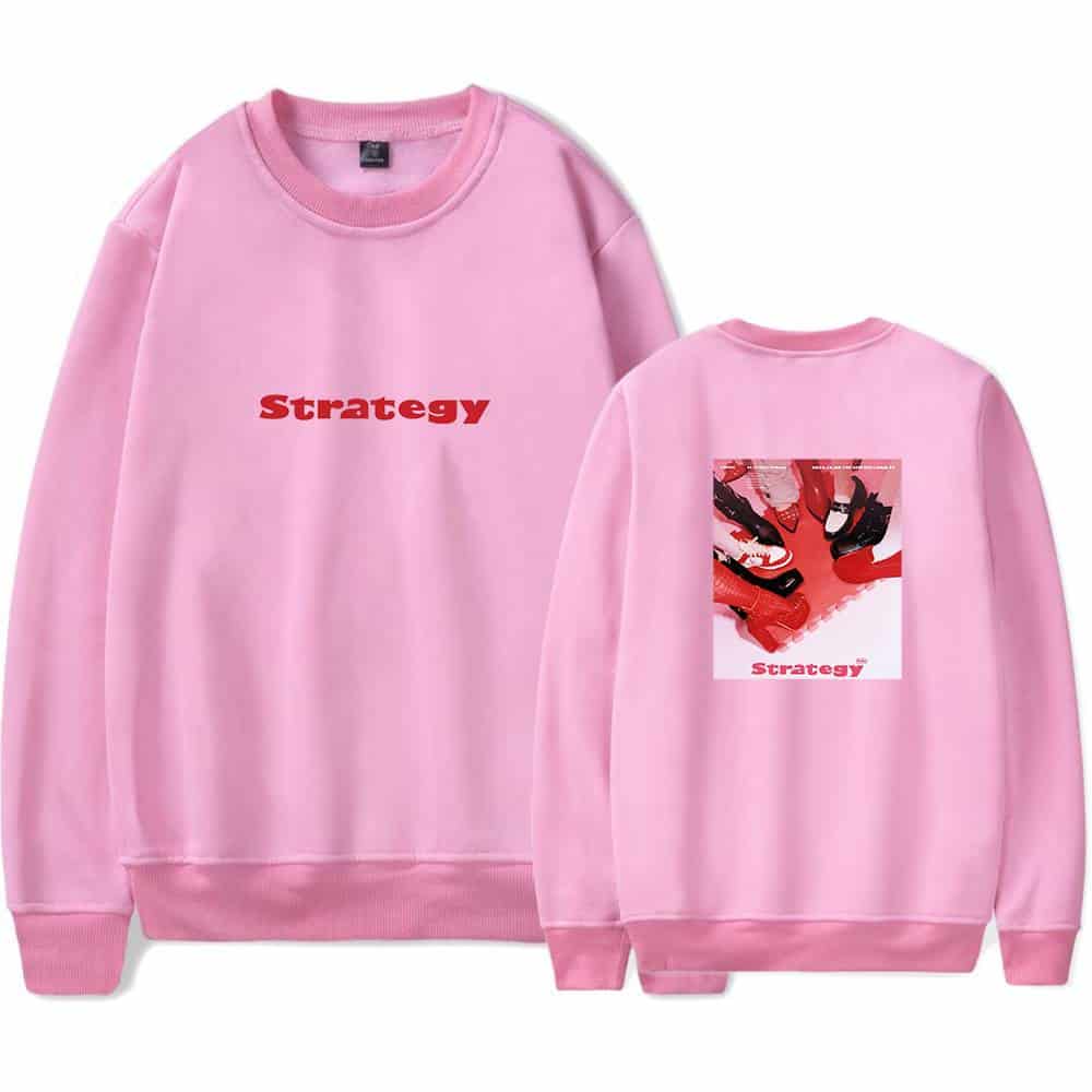 Strategy pink sweatshirt with bold red text and a graphic print featuring multiple shoes on the back. Perfect for streetwear fashion statements and casual styling.