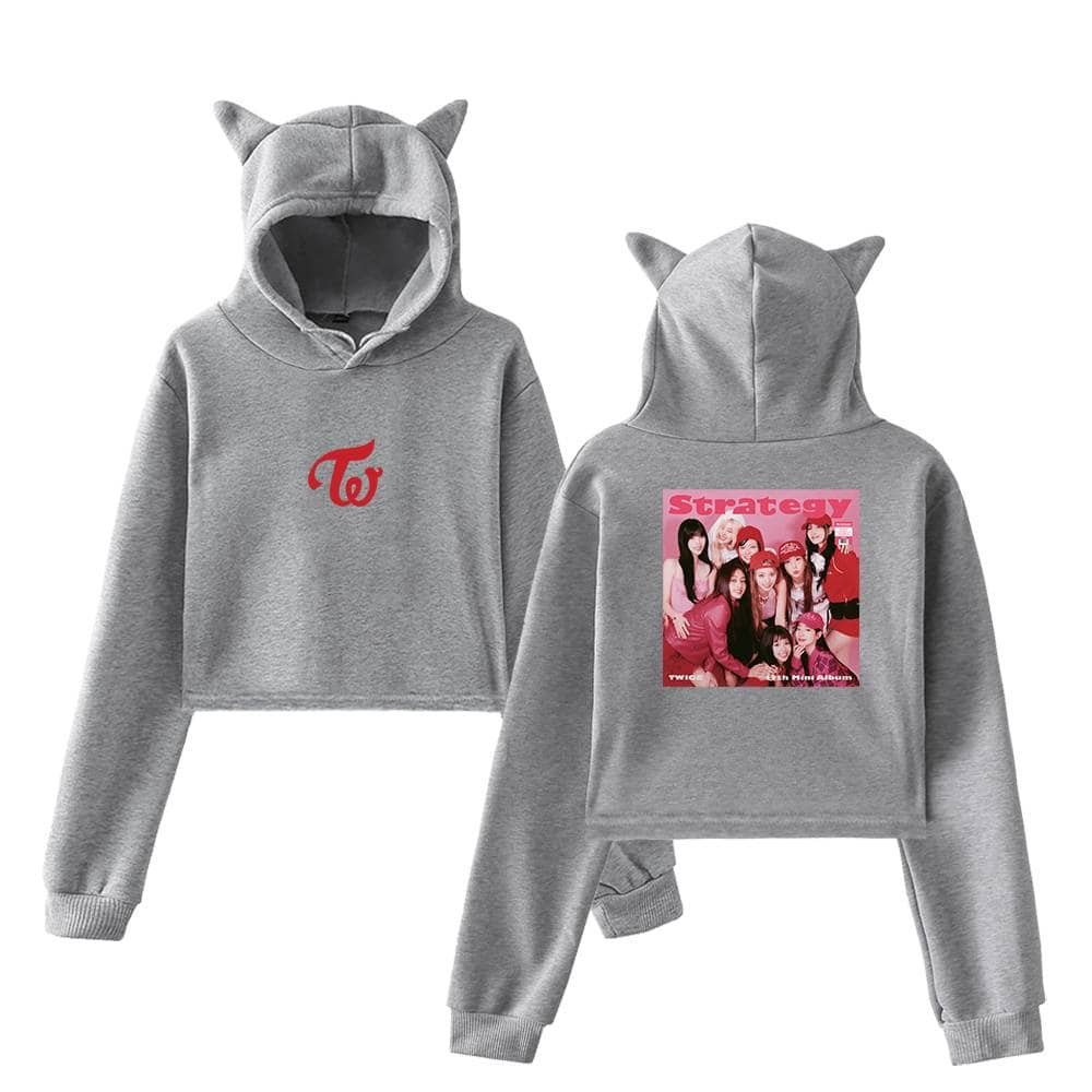 Twice TWICE K-pop girl group merchandise hoodie with cute cat ears hood and printed group image on the back. Perfect for fans to show support and love for the popular girl group. Made of comfortable, stylish material.